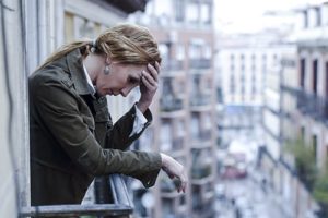 woman at open window contemplating jumping needs crack addiction treatment right away