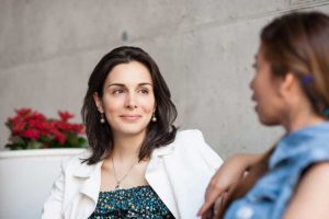 Two women discussing sobriety at a women's detox program